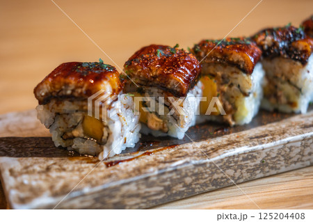 Unagi with Foie gras roll served on plate Unagi with Foie gras roll served on plate 125204408