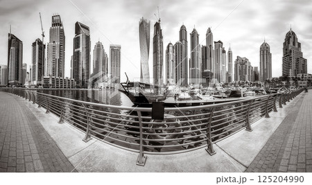 Panoramic view of Dubai Marina bay with yacht and cloudy sky, Dubai, UAE. Panoramic view of Dubai Marina bay with yacht and cloudy sky, Dubai, UAE. 125204990
