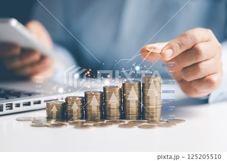 Saving money concept. Money coin stack with growing business graph. financial investment. Profit from the business investment. Money management and Financial chart Saving money concept. Money coin stack with growing business graph. financial investment. Profit from the business investment. Money management and Financial chart 125205510