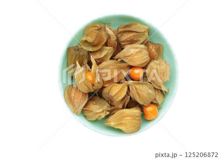 Physalis peruviana fruit on mint plate isolated on white background. 125206872