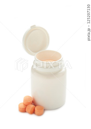 Vitamin C pills with jar isolated on white background. Vitamin C pills with jar isolated on white background. 125207130