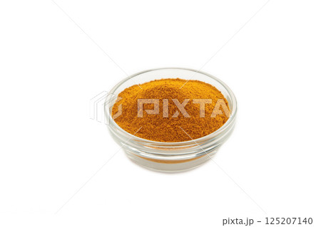 Turmeric (Curcuma) powder on glass bowl isolated on white background 125207140