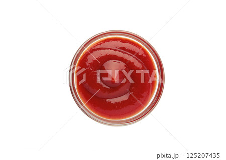 Small glass condiment bowl of red tomato sauce ketchup isolated on white background. 125207435