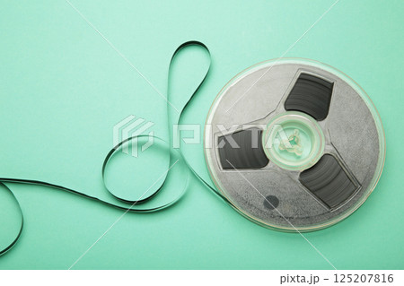 Film reel on mint background. Space for text Film reel on mint background. Space for text 125207816