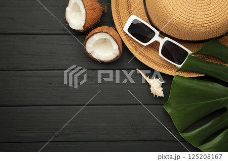 Summer accessories with coconuts on black background. 125208167