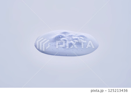 A drop of blue serum with bubbles. 125213436