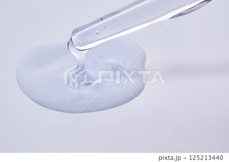 Pipette with delicate blue serum close-up. Pipette with delicate blue serum close-up. 125213440