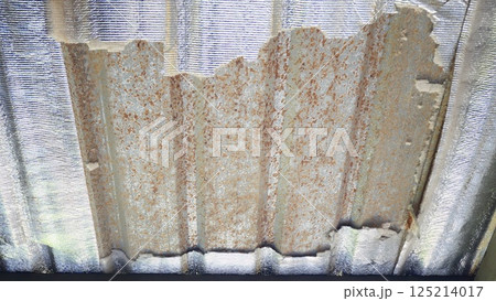 The metal sheet with heat insulation is in a deteriorated condition The metal sheet with heat insulation is in a deteriorated condition 125214017