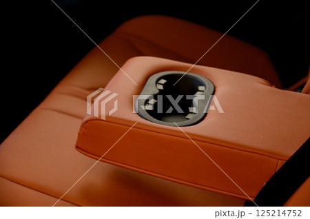 Cup holders inside modern car interior 125214752