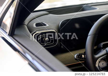 Close up of modern new car interior with black leather seats Close up of modern new car interior with black leather seats 125214783