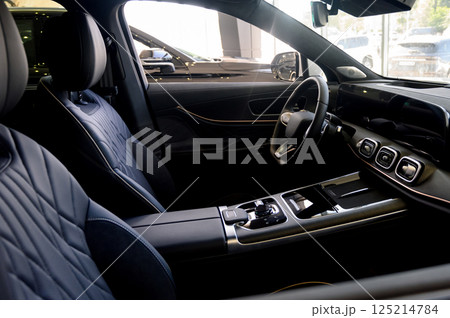 Close up of modern new car interior with black leather seats 125214784