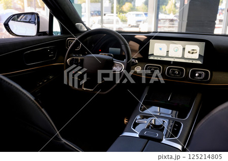 Car interior - steering wheel, shift lever and dashboard. Car modern inside. Front view 125214805