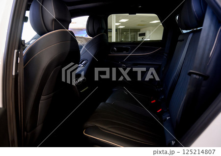 Close up of modern new car interior with black leather seats Close up of modern new car interior with black leather seats 125214807