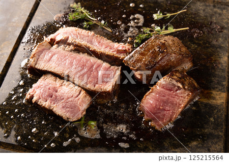 Delicious medium rare filet steaks Delicious medium rare filet steaks 125215564