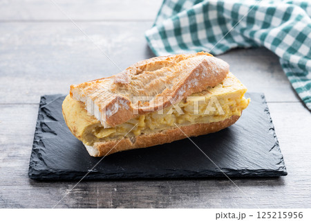 Spanish potato omelette sandwich isolated on white background Spanish potato omelette sandwich isolated on white background 125215956