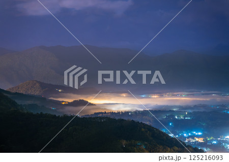 Mystical Spring Night: Mist and Lights in Yuchi's Mountain Forest. 125216093