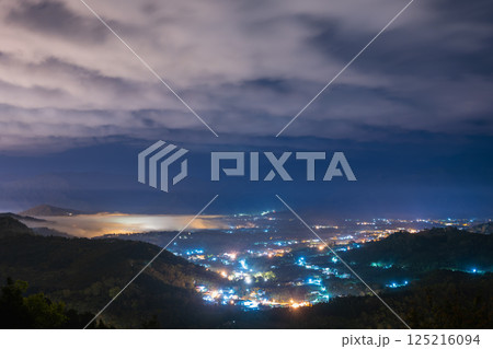Mystical Spring Night: Mist and Lights in Yuchi's Mountain Forest. 125216094