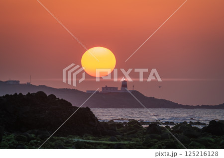 Sunset at Shimen Coast with Lighthouse, Taiwan. Sunset at Shimen Coast with Lighthouse, Taiwan. 125216128