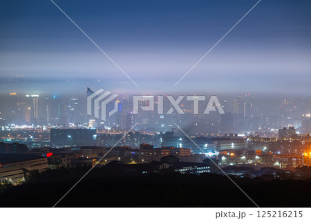 Twilight Dreams: Taichung City Beneath the Veil of Spring Mist. Twilight Dreams: Taichung City Beneath the Veil of Spring Mist. 125216215