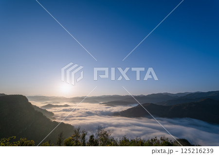 Ethereal Morning Glow: Dancing Light and Clouds in Xindian, Taiwan. 125216239