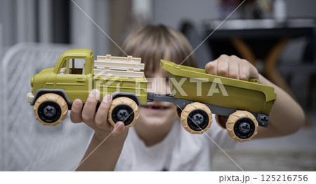 Child with autism playing with cars Child with autism playing with cars 125216756