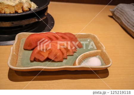 Traditional Japanese Meal with Rice, Sliced Tomatoes 125219118