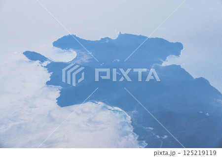 View of a Serene Coastal Island Surrounded by Blue Ocean 125219119