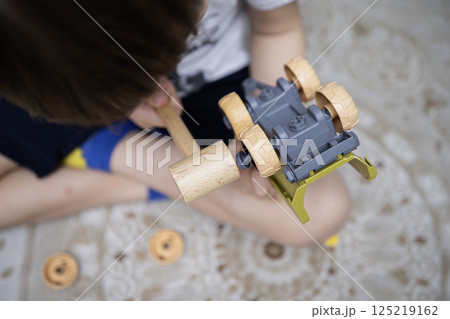 Child with autism playing with cars. Autism concept Child with autism playing with cars. Autism concept 125219162