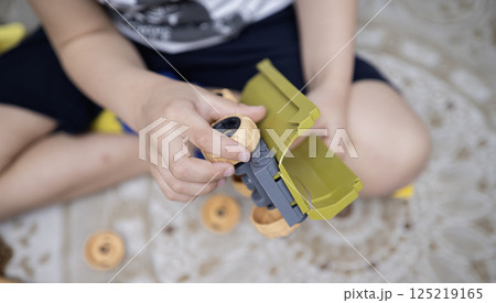 Child with autism playing with cars. Autism concept 125219165