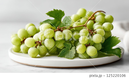 Freshly washed green grapes kitchen counter food photography bright close-up healthy snack 125220106
