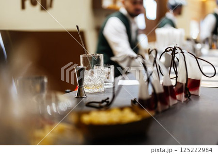 Crafting unique cocktails with fresh ingredients at a local bar counter 125222984