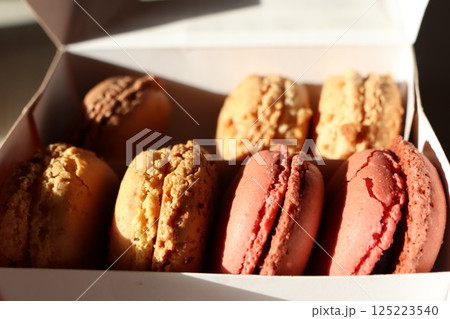 Experience a Delicious and Colorful Assortment of Macarons Packed in a Beautiful Box 125223540