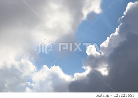 Stunning Clouds with Beautiful Rays of Sunlight Majestically Breaking Through the Sky Stunning Clouds with Beautiful Rays of Sunlight Majestically Breaking Through the Sky 125223653