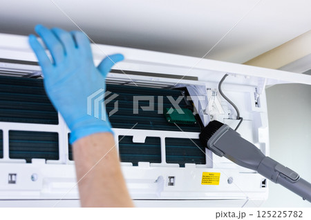 Professional Cleaning of Air Conditioning Unit: Maintenance Importance for Indoor Air Quality and Environmental Health Compliance Standards Professional Cleaning of Air Conditioning Unit: Maintenance Importance for Indoor Air Quality and Environmental Health Compliance Standards 125225782
