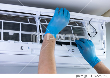 Maintaining Your Air Conditioning System: A Step-by-Step Guide on Professional Filter Replacement for Optimal Performance and Air Quality Control Maintaining Your Air Conditioning System: A Step-by-Step Guide on Professional Filter Replacement for Optimal Performance and Air Quality Control 125225940