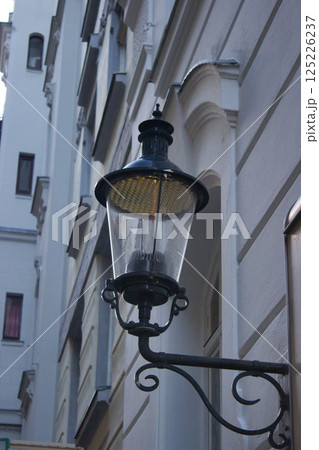 Vintage street lamp on historic building 125226237