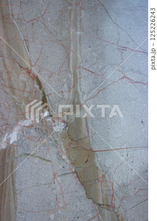 Close-up of light marble slab with red mineral veins Close-up of light marble slab with red mineral veins 125226243