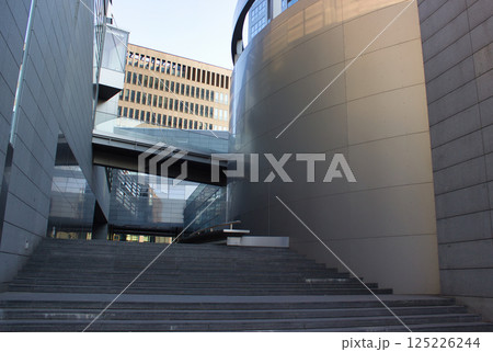 Modern architectural space with glass and concrete structures Modern architectural space with glass and concrete structures 125226244