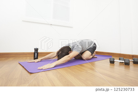 Man Stretching at Home. Man Doing Exercises at Home. Home Workout. Man Doing Sports at Home. Home Sport, Healthy Life, Quarantine Concept 125230733