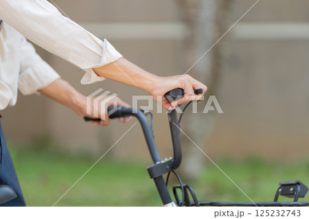 Bicycle Handling and Awareness. Close-up of hands on bicycle handlebars, emphasizing control and safety. Bicycle Handling and Awareness. Close-up of hands on bicycle handlebars, emphasizing control and safety. 125232743