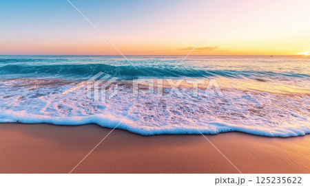 The ocean is calm and the sky is a beautiful orange color 125235622