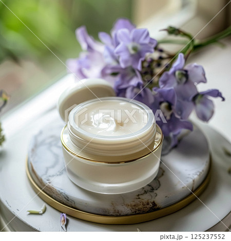 Cosmetic cream in a glass jar. Skin care concept. Background for beauty products 125237552