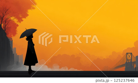 silhouette of person with umbrella stands against orange sky 125237646