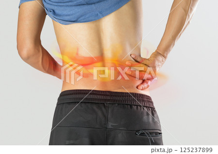 Man experiences shingles rash along waistline. 125237899