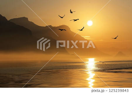 The birds are scattered throughout the sky, with some flying closer to the water 125239843