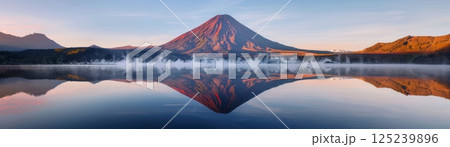 Mountain Reflections on Tranquil Lake at Sunrise Mountain Reflections on Tranquil Lake at Sunrise 125239896