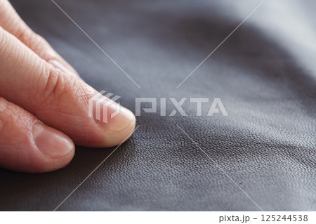 Closeup man check full grain gray brown leather background Closeup man check full grain gray brown leather background 125244538