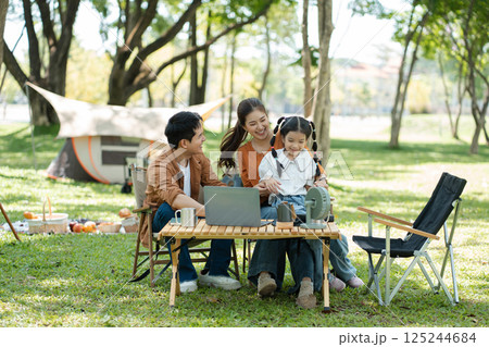Happy asian family picnic in park, weekend lifestyle outdoors. Happy asian family picnic in park, weekend lifestyle outdoors. 125244684