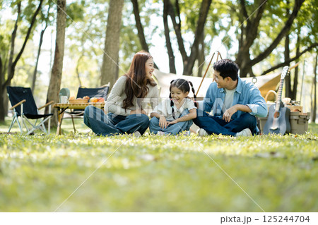 Happy asian family picnic in park, weekend lifestyle outdoors. Happy asian family picnic in park, weekend lifestyle outdoors. 125244704