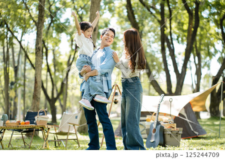 Happy asian family picnic in park, weekend lifestyle outdoors. 125244709